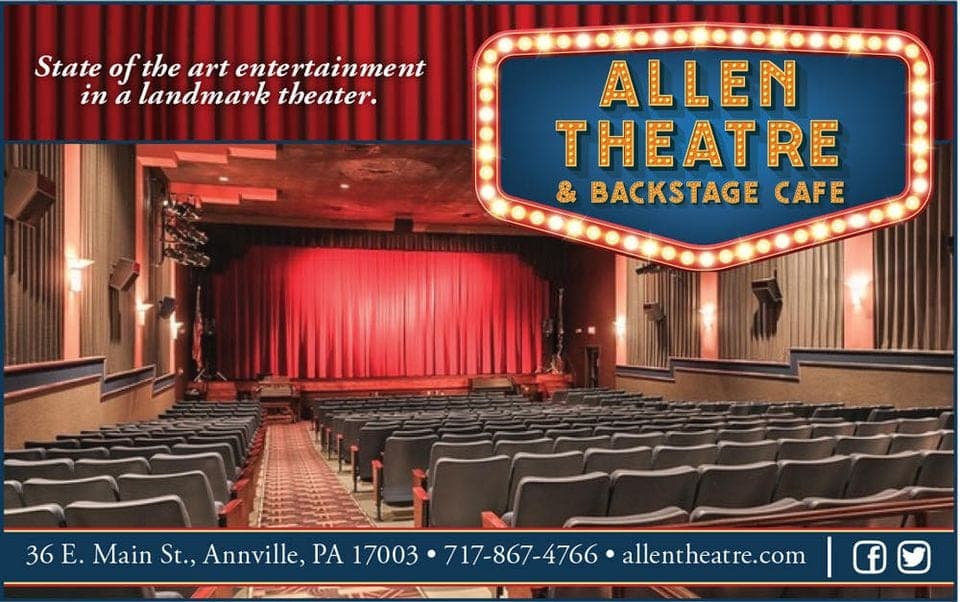 Interior of the Allen Theatre, featuring rows of seats and a large, red curtain.