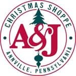 Logo for A&J Christmas Shoppe in Annville, Pennsylvania, featuring a Christmas tree and ornament.