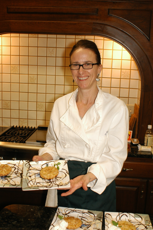 French Chef shows off one of her dishes during Acclaimed Chef Cooking Class