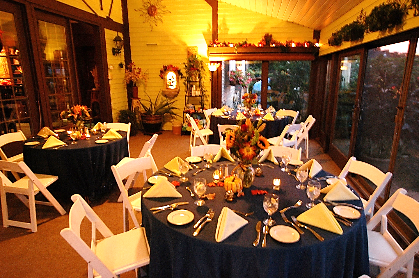 Annville Inn's Garden Room reset to have three round tables set up with eight place settings each for a catered dinner during a reunion.