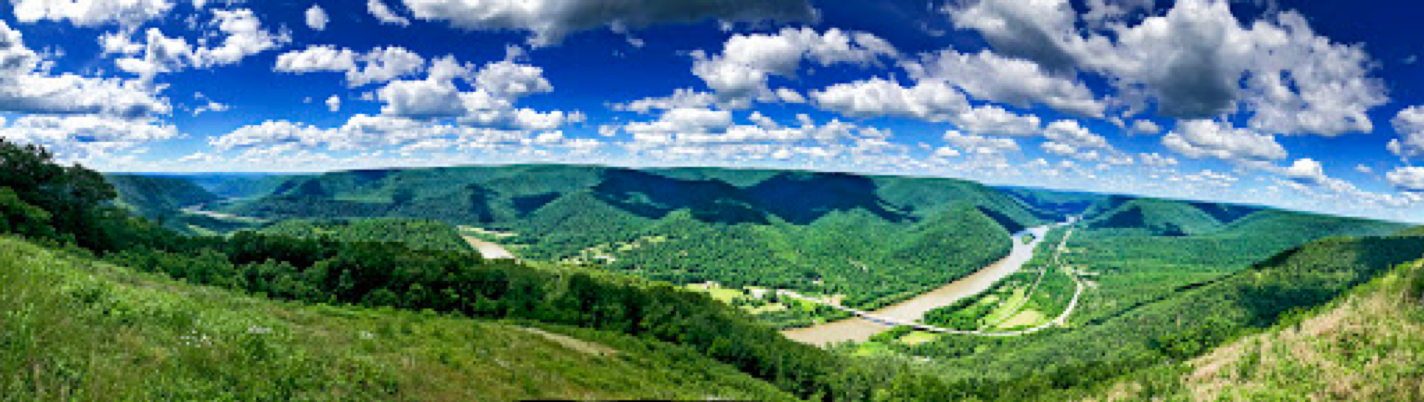 view of pennsylvania mountains with river and bright blue sky