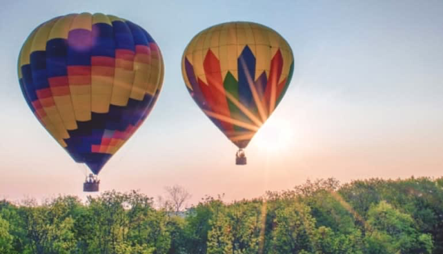 two hot air balloons, very colorful