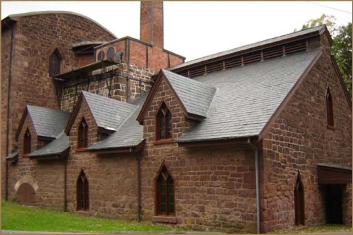 Exterior of Cornwall Iron Furnace, a brownstone building