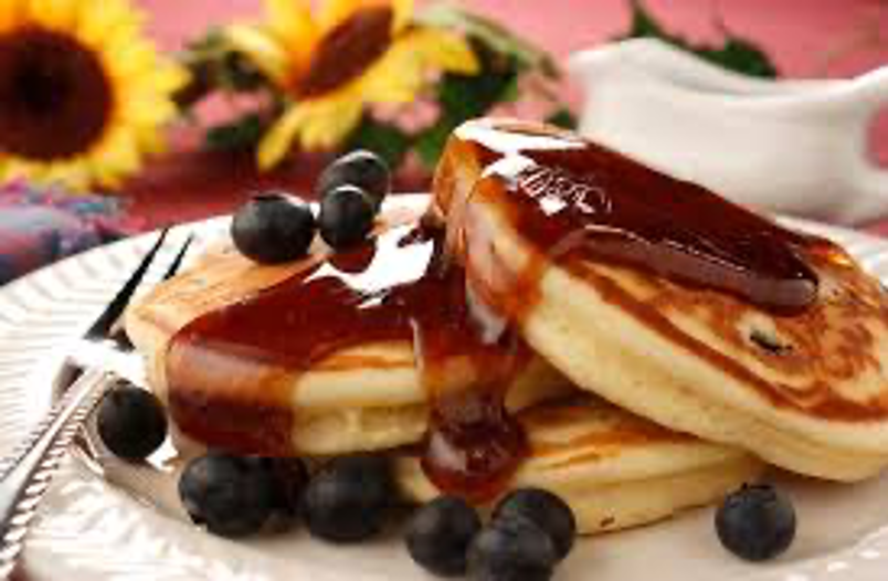 Breakfast pancakes with blueberries and syrup