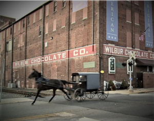 Amish buggy passing Wilbur Chocolate Factory