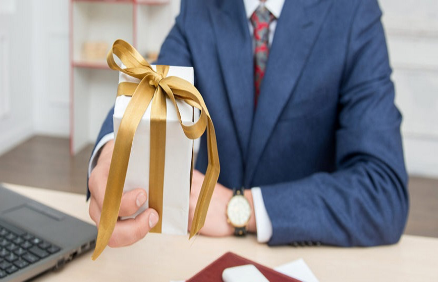 Man presenting wrapped gift