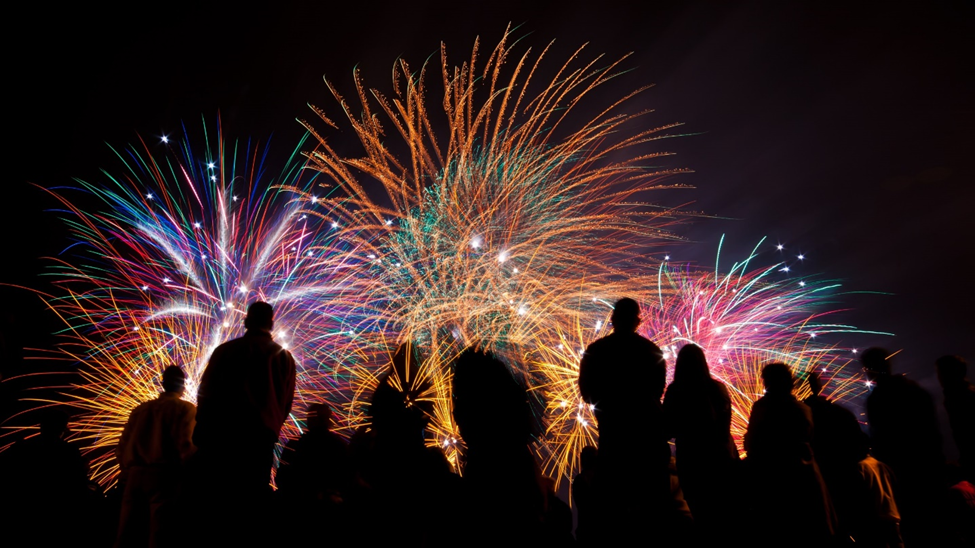 Image of silhouettes of people watching fireworks going off. Celebrate New Years at Annville Inn

