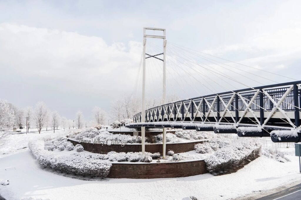 Photo of Lebanon Valley College's bridge in winter with snow covering it.