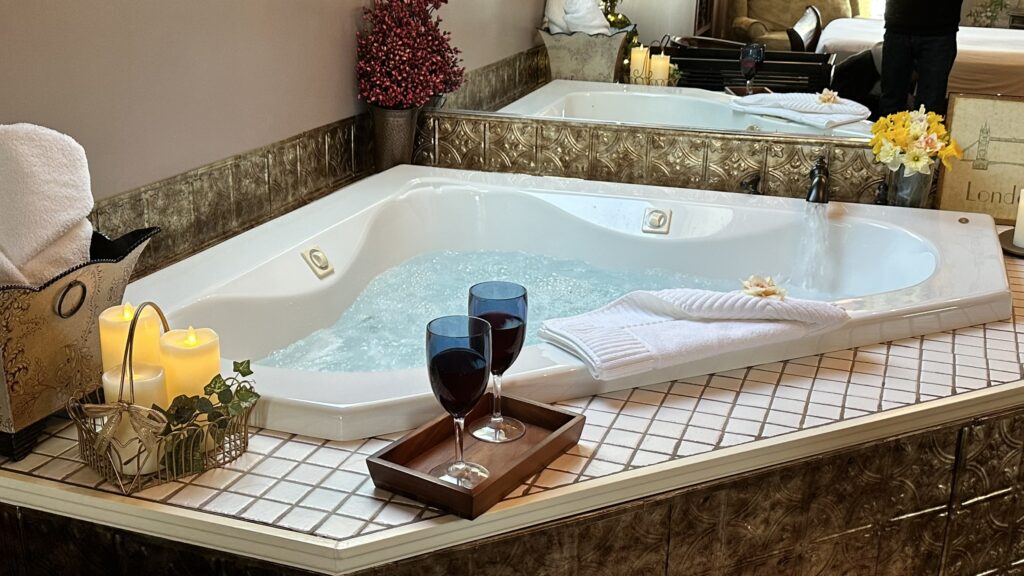 Photo of a jacuzzi with wine glasses and candles. Valentines in Hershey