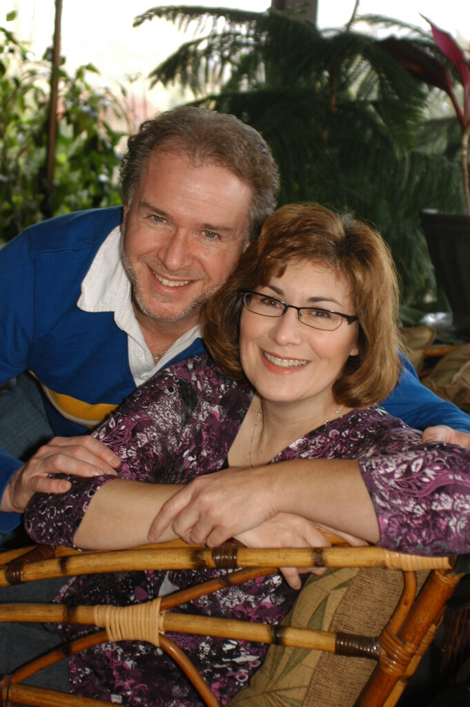 Photo of a couple sitting together on a Valentines trip in Hershey