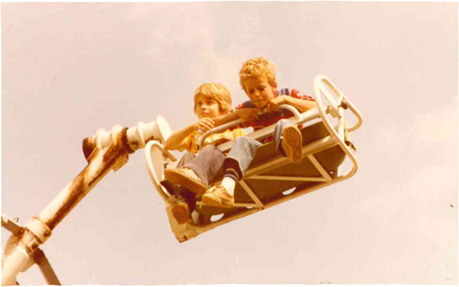 Two boys on a carnival ride