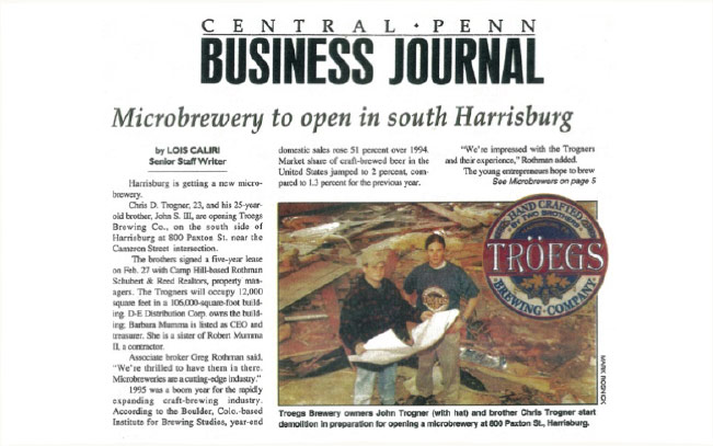 photo of a clipping from the Central Penn Business Journal. Shows two brothers working in a brewery.