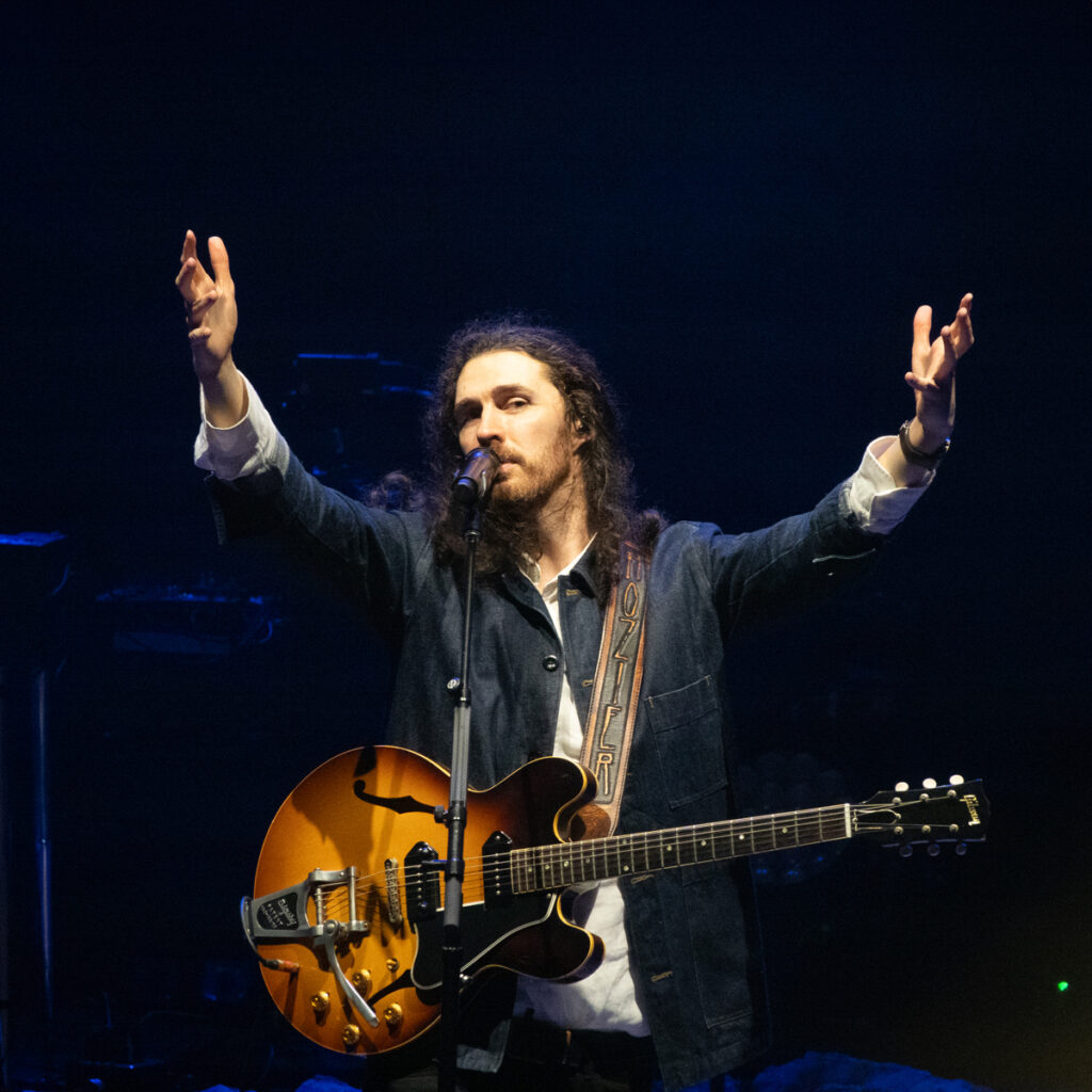 Image of Hozier performing in a concerts. Coming soon to Hersheypark Stadium.