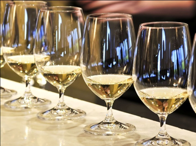 Wine glasses filled with wine.  Unique wine tasting experience.